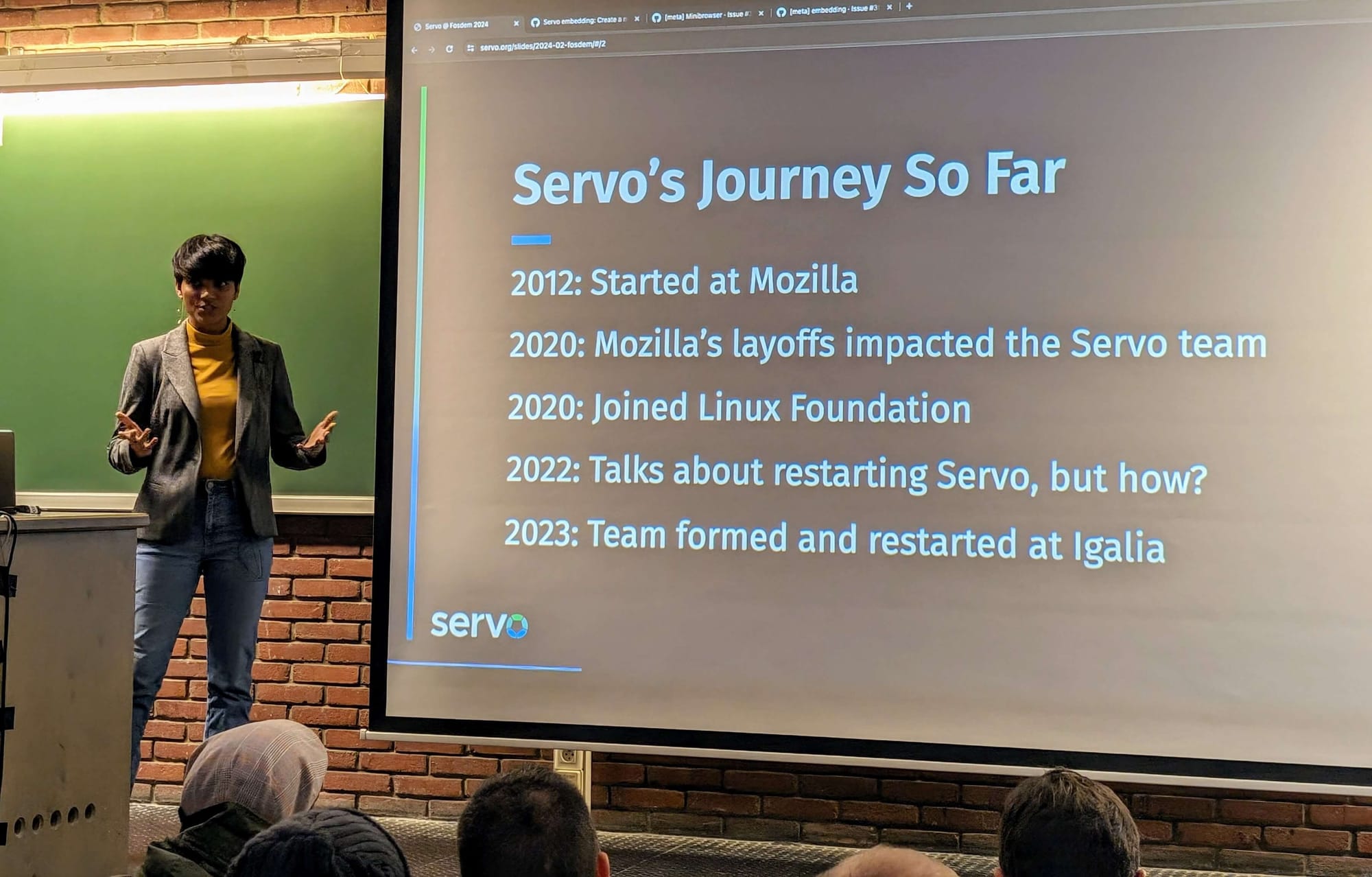 a photo showing a servo project member presenting servo's journey so far