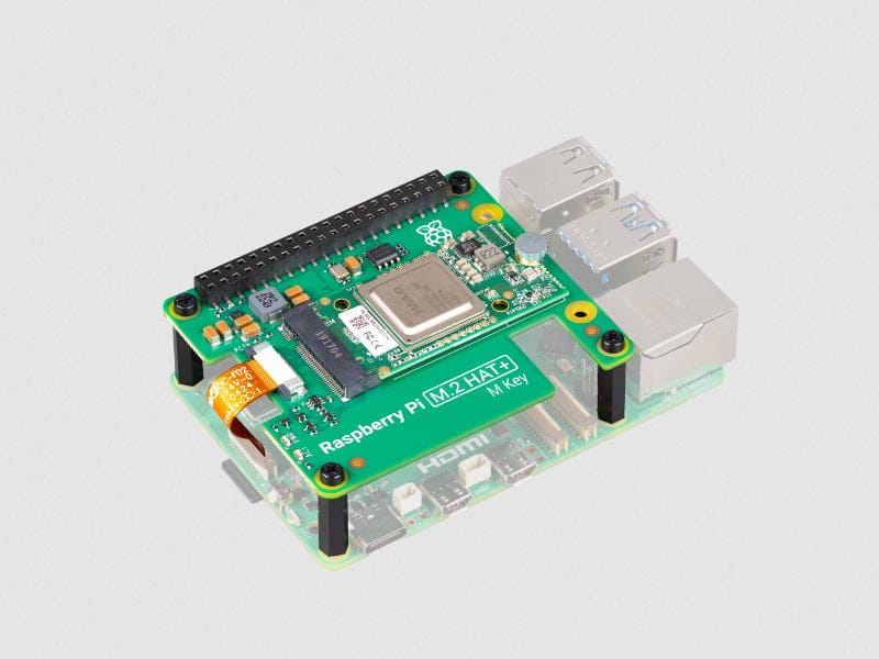 a photo of the raspberry pi ai kit installed on top of a raspberry pi 5